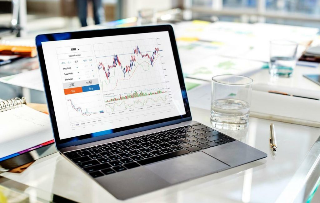A laptop that features candlestick trading patterns in the Forex market A laptop that features candlestick trading patterns in the Forex market