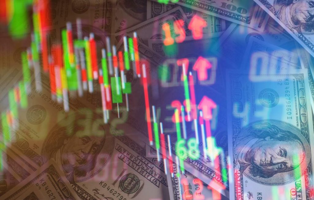 A trading chart with US dollars in the background represents trading profit