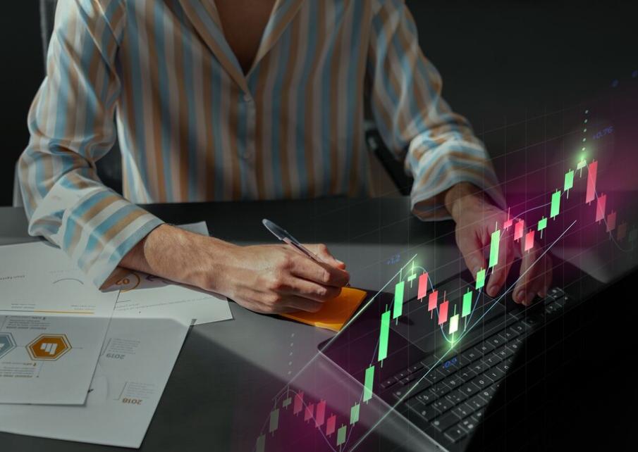 Person analyzing data with technical indicators to do short-term trading.